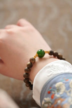 Kynam Agarwood Bracelet, Spinach-Green Nephrite Jade Focal Bead